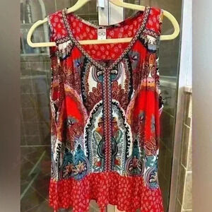 Bright and colorful summer sleeveless top with ruffle at bottom. Size S.